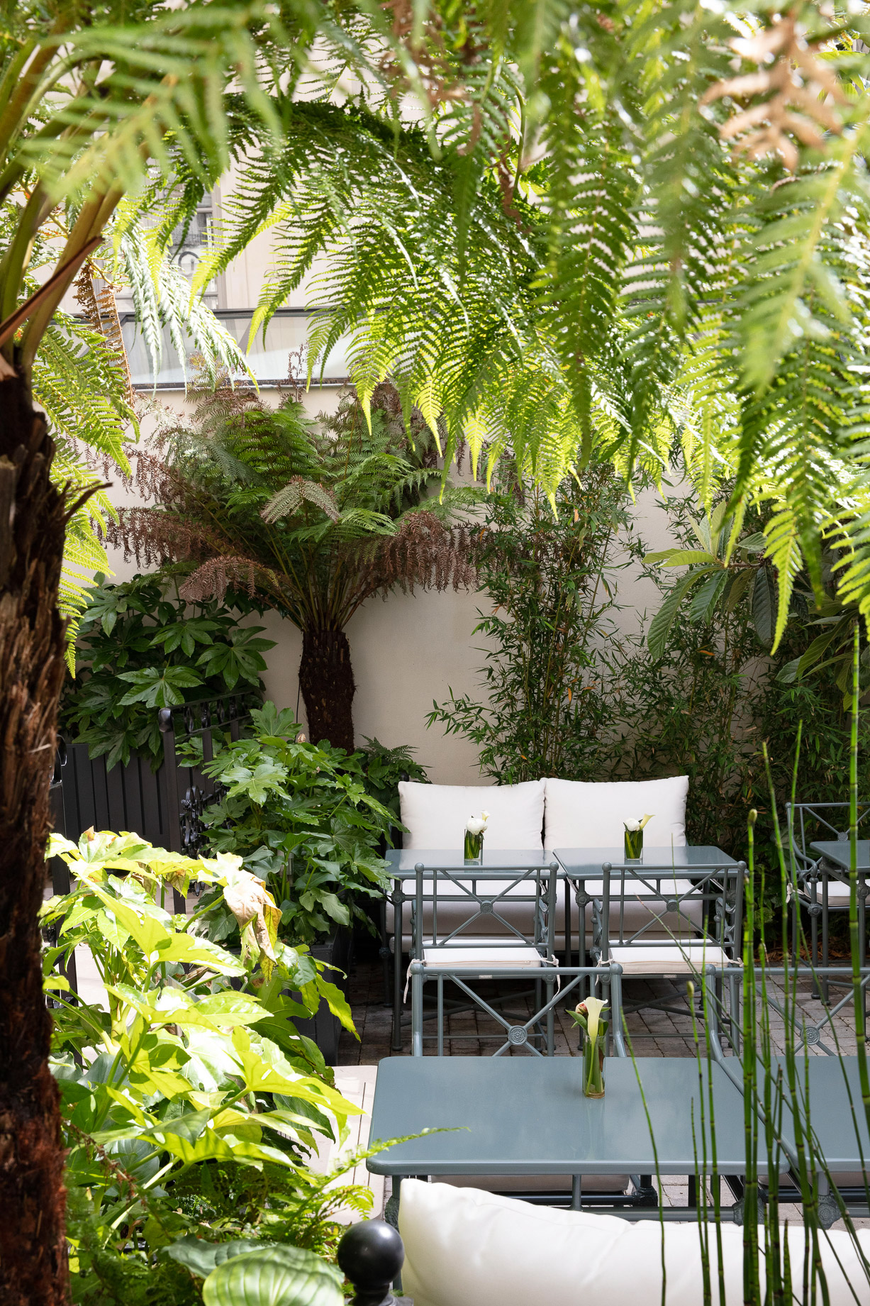 Terrace and garden of the 5-star boutique hotel Les Jardins du Faubourg, close to the Champs-Elysées