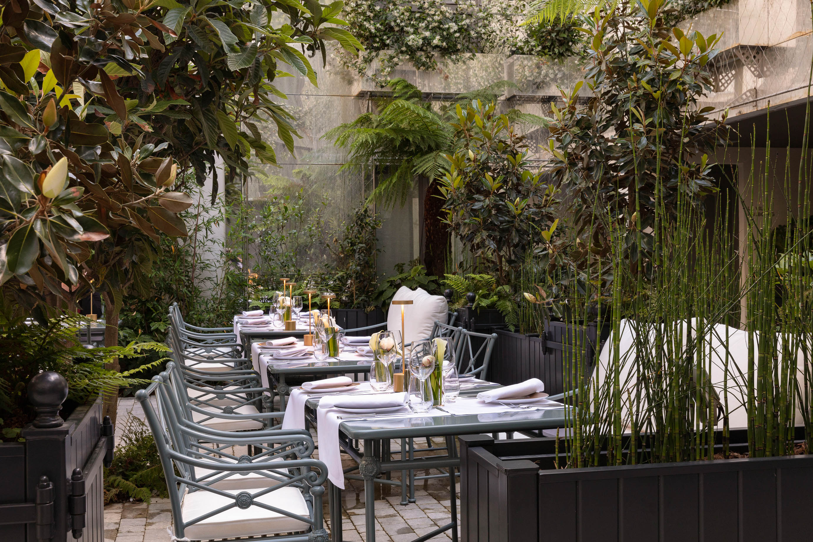 Garden and terrace of the bistronomic restaurant at the Les Jardins du Faubourg hotel, near the Champs-Elysées in Paris